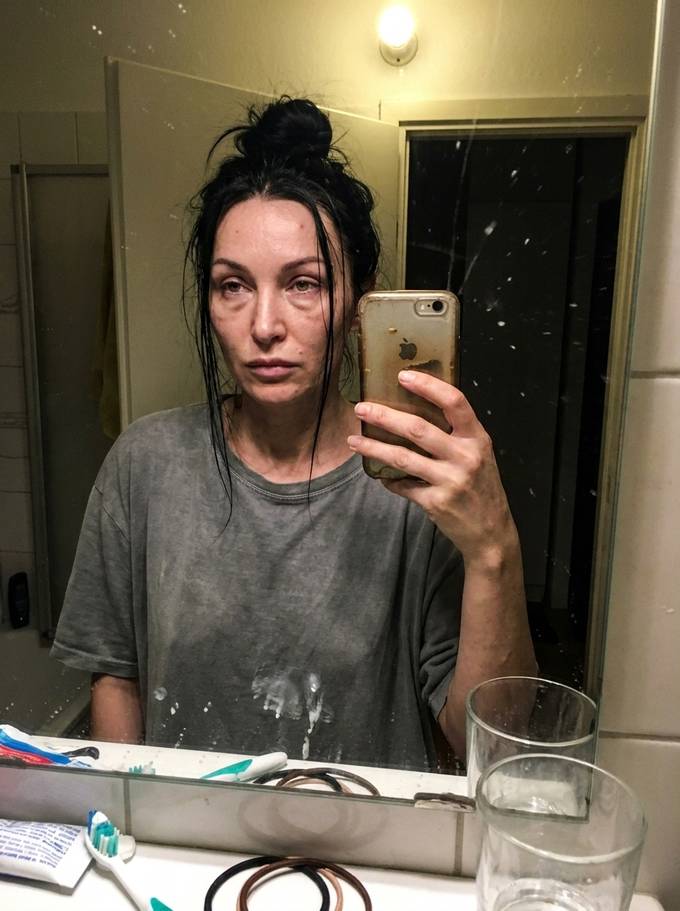 Elena Novak photographed in her bathroom mirror