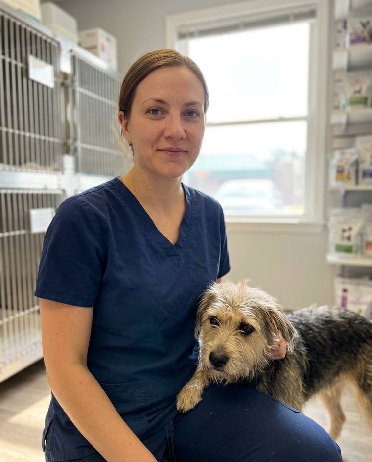 Natalie, a veterinary assistant, with her brindle dog Otter
