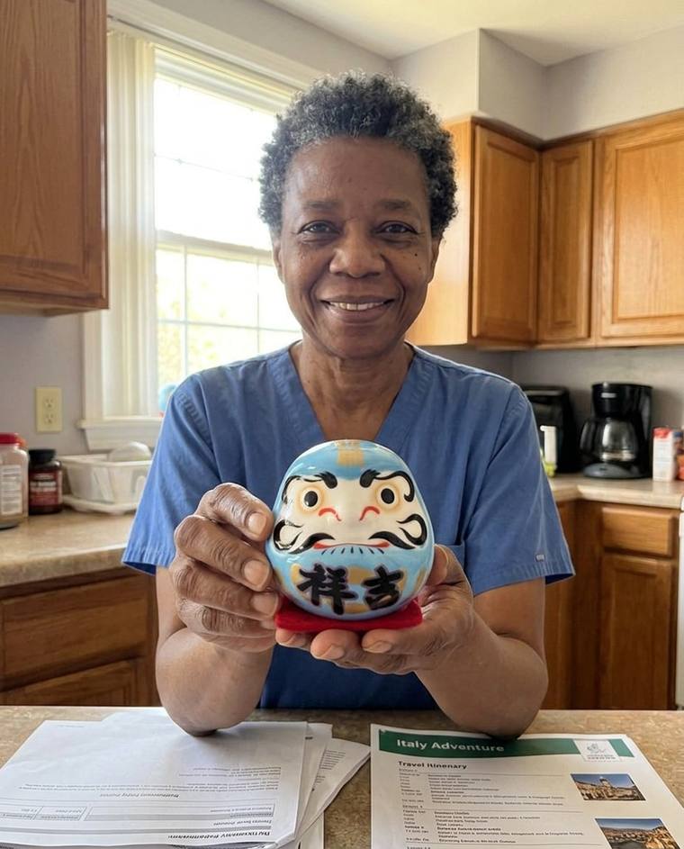 Susan filling in the second eye of the blue Daruma